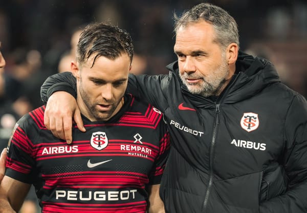 Toulouse manager Ugo Mola with his arm around scrum-half Paul Graou